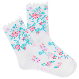 A pair of white crew socks with a floral print and lettuce-edge trim.