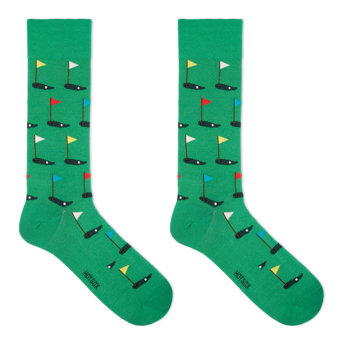 A pair of green crew socks with a pattern of golf flags.
