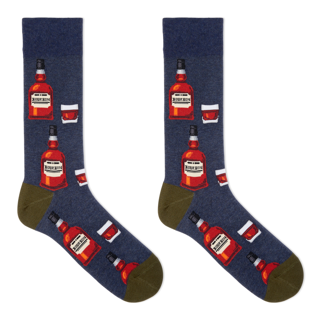 A pair of men's crew socks with a bourbon design, featuring illustrations of bourbon bottles and a glass on a navy background.